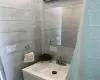 Full bathroom with a shower with curtain and a sink