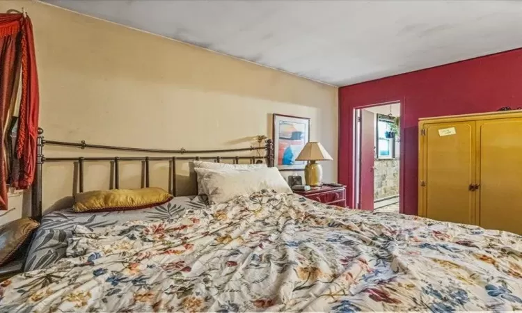 Bedroom featuring a baseboard radiator