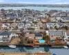 Drone / aerial view featuring a water view and a residential view