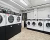 Common laundry area with separate washer and dryer