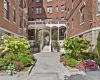 Doorway to property featuring brick siding