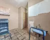 Kitchen featuring under cabinet range hood and wood finished floors