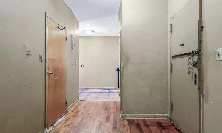 Hallway featuring hardwood / wood-style floors