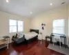 Bedroom with recessed lighting, visible vents, hardwood / wood-style floors, vaulted ceiling, and baseboards