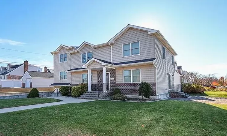 View of front of house with a front lawn