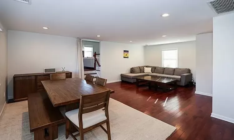 Dining space featuring a wealth of natural light, wood-type flooring, visible vents, and recessed lighting