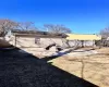 Back of house with a gate and fence