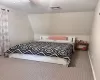 Bedroom featuring lofted ceiling, carpet floors, visible vents, and a ceiling fan