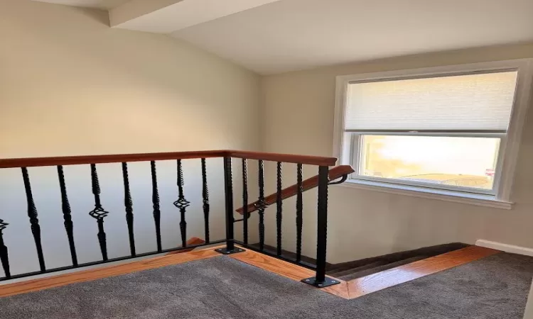 Staircase with lofted ceiling