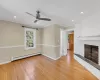 Unfurnished Den  , a fireplace, light wood flooring, and crown molding