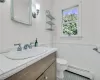 Half bathroom featuring wainscoting