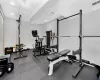 Exercise room featuring recessed lighting, visible vents, and a drop ceiling