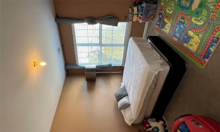 Carpeted bedroom featuring visible vents and baseboards