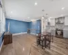 Dining area with visible vents, baseboards, wood finished floors, crown molding, and recessed lighting