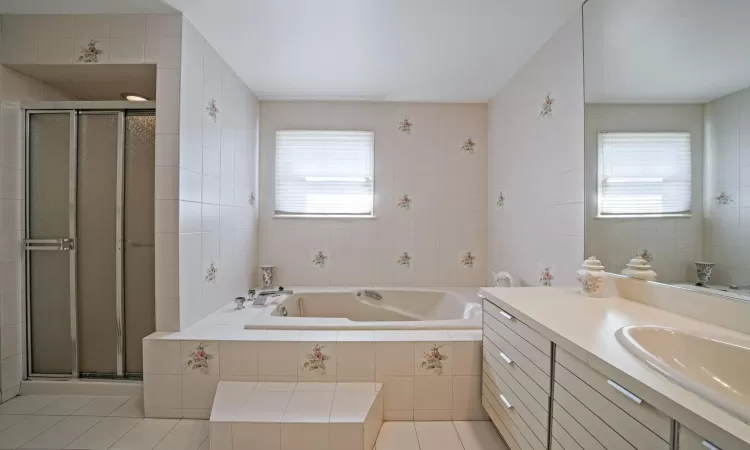 Bedroom featuring a baseboard radiator, visible vents, ceiling fan, and carpet flooring