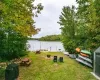 View of yard featuring a fire pit and a water view