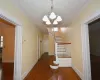 Hall featuring a textured ceiling, a textured wall, and ornamental molding