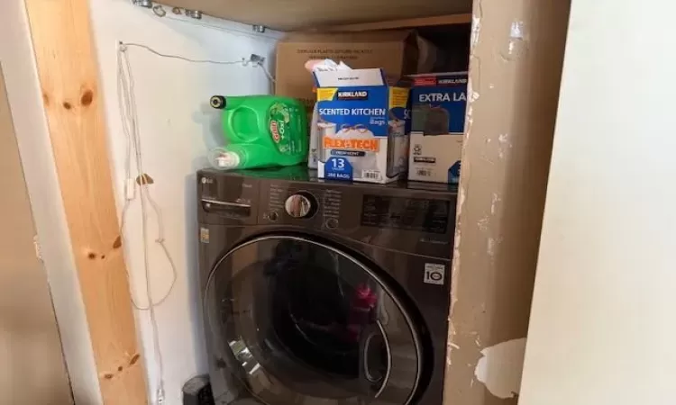 Washroom with laundry area and washer / clothes dryer