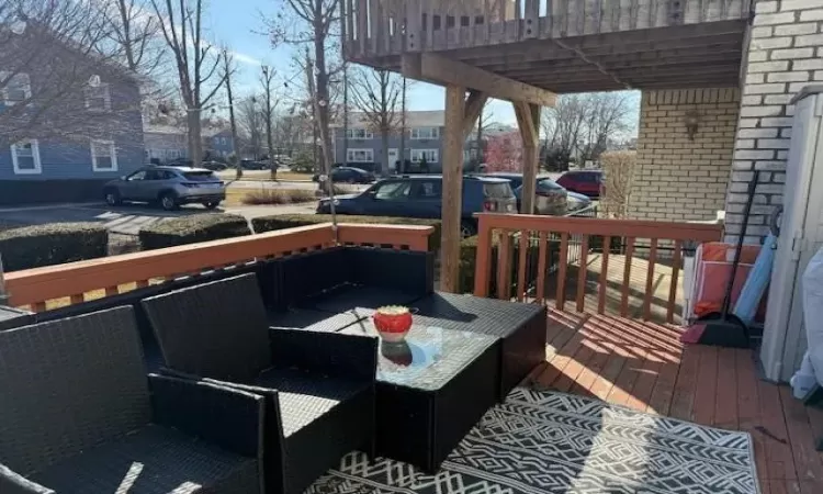 Wooden terrace with an outdoor living space