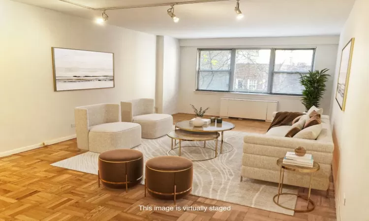 Living area with radiator and baseboards