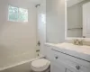 Bathroom with vanity, bathtub / shower combination, and toilet