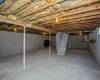 Unfinished basement with water heater and heating fuel