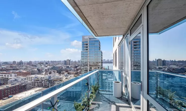 Balcony featuring a view of city