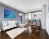 Living area featuring hardwood / wood-style flooring and baseboards