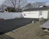 View of pool featuring fence and an outbuilding