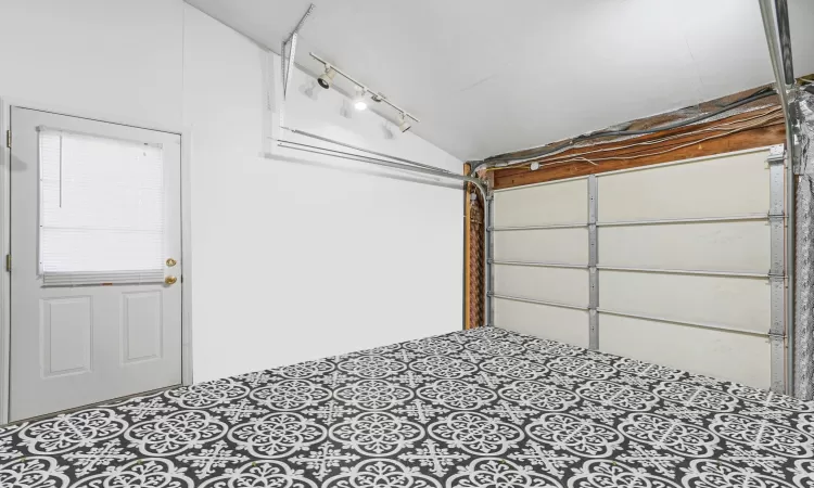 Virtually staged to show what garage looks like empty