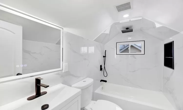 Full bathroom featuring toilet, a combined bath / shower with rainfall shower, vanity, visible vents, and vaulted ceiling