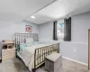 Bedroom featuring carpet flooring and baseboards