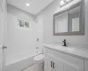 Bathroom with toilet, recessed lighting, vanity, and shower / bathtub combination