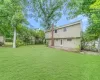 View of yard with a garage and fence