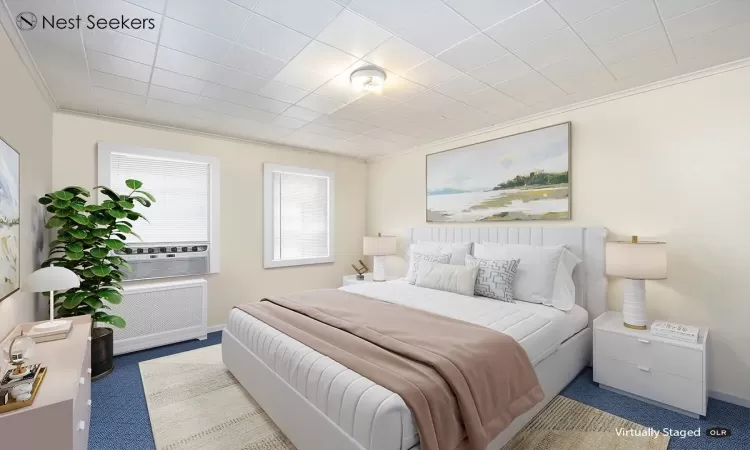 Bedroom featuring baseboards, carpet floors, and crown molding