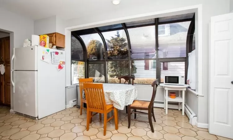 Dining space with a baseboard heating unit