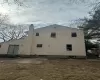 View of side of home featuring a patio area and a chimney