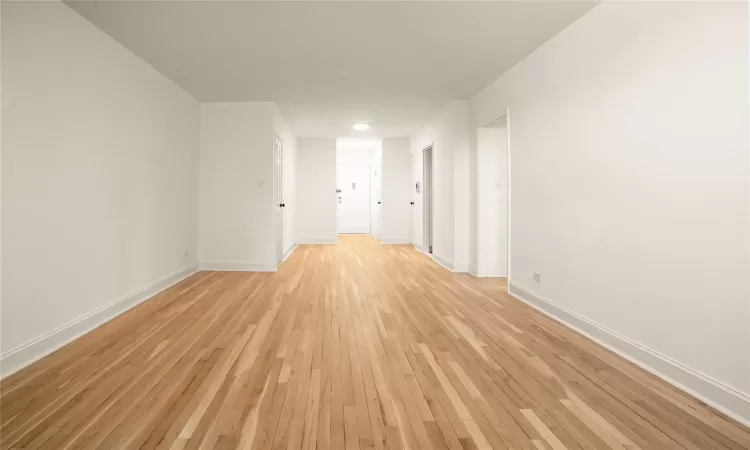 Living room facing entry and dining area