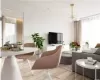 Living room featuring wood finished floors and a notable chandelier