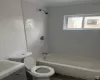 Full bathroom with tub / shower combination, crown molding, vanity, and toilet