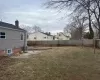 View of yard with a fenced backyard and central AC unit