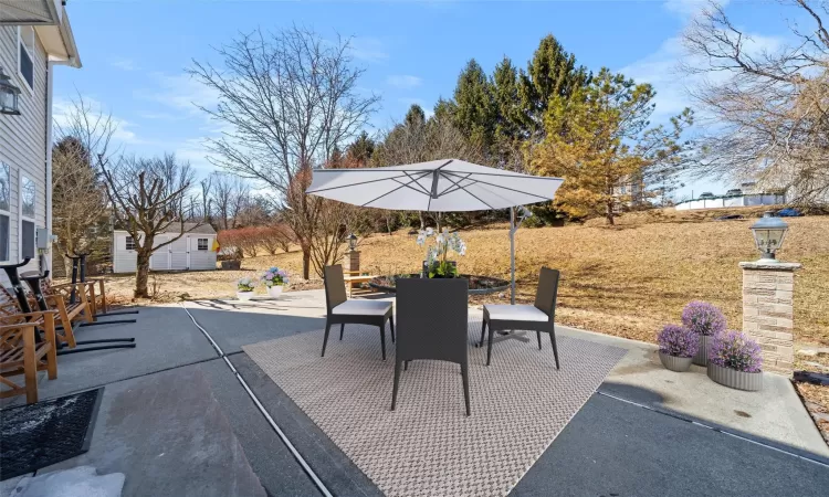 View of patio / terrace with outdoor dining space and an outdoor structure