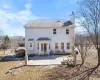 Rear view of house featuring a patio and a chimney