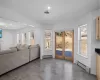 Living room featuring a baseboard radiator, visible vents, recessed lighting, and wood finished floors