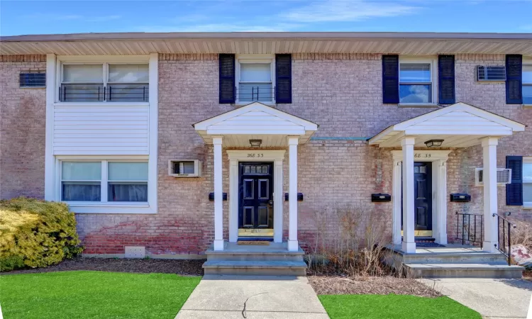 View of front of house featuring brick siding