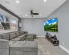 Living area featuring recessed lighting, light wood-type flooring, a ceiling fan, and baseboards