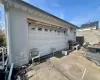 Garage featuring driveway and fence