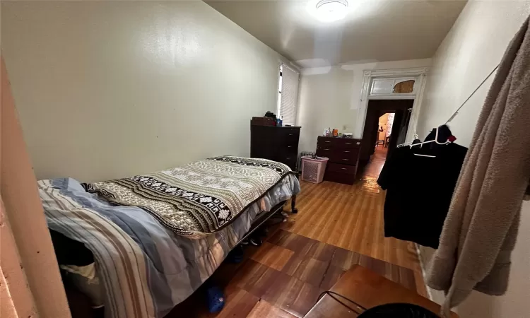 Bedroom with wood finished floors