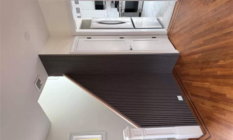 Kitchen featuring appliances with stainless steel finishes, a sink, light stone countertops, and tasteful backsplash