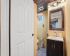 Bathroom featuring vanity and toilet